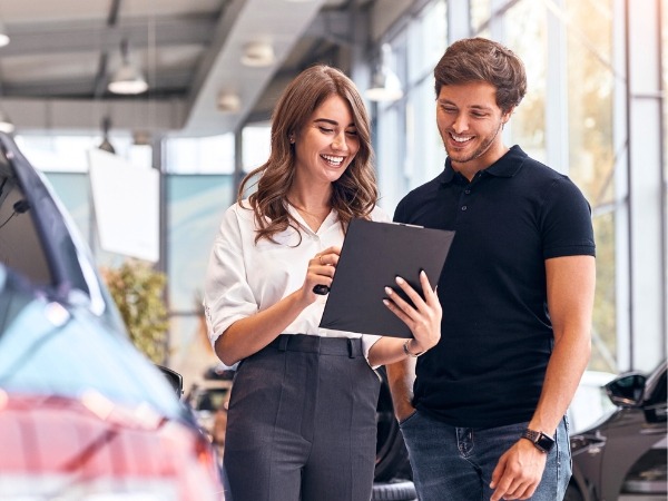 Man and Woman Looking at a Document