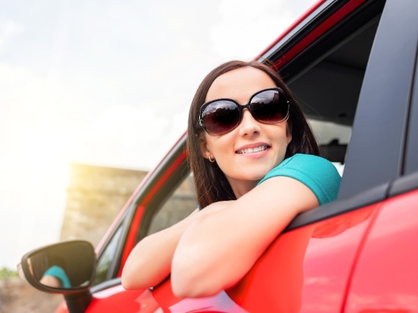 Woman in a Red Car