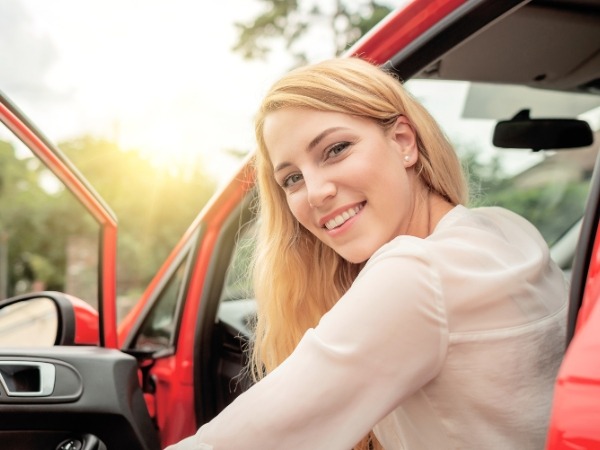Woman in a Red Car