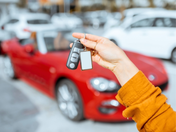 Woman Holding Car Rental Keys