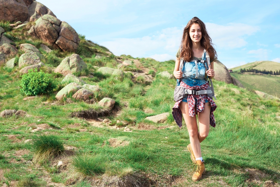 Woman Hiking a Mountain