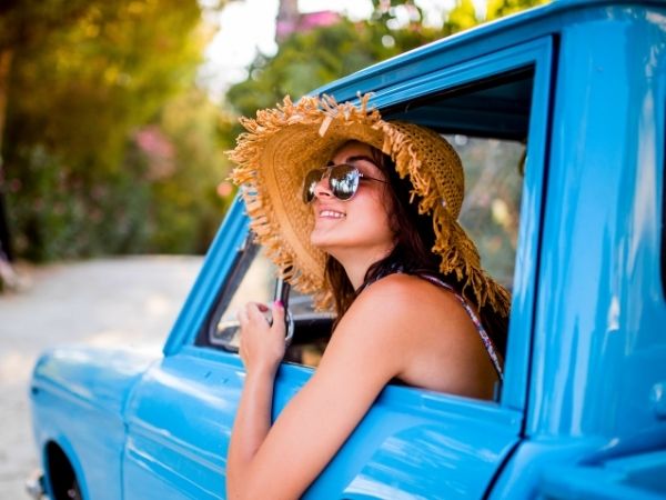 Woman in a rental car